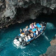 group of people on zodiac raft